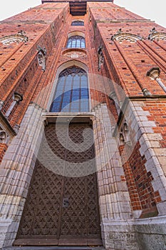 Massive old great door to the church, entrance to the temple in Torun Poland