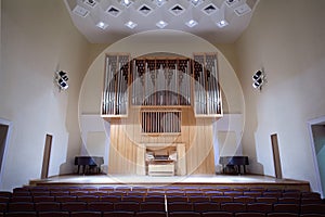 Massive pipe organ in empty concert hall