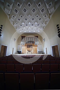 Massive pipe organ in empty concert hall