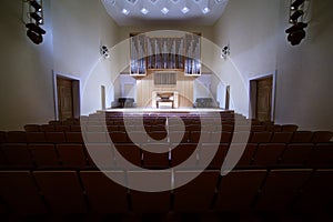 Massive pipe organ in empty concert hall