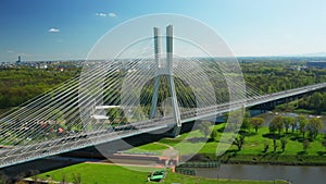 Massive pylon bridge spanning Oder river flowing by Wroclaw