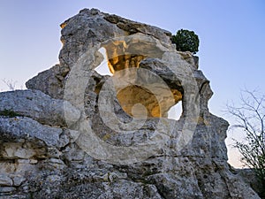 Massive rock formation with two holes near Les Baux de Provence