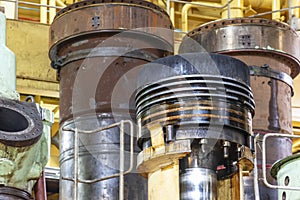 Massive ship's engine piston with carbon deposits, removed from main engine, ready for overhauling.