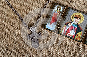 A massive silver pectoral cross with the image of the Archangel Michael and an Orthodox icon