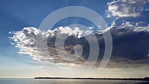 Massive Stratocumulus Clouds over the beach at La Baule in France photo