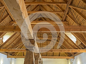 Massive timber structure timberwork of roof on old baroque farm house made