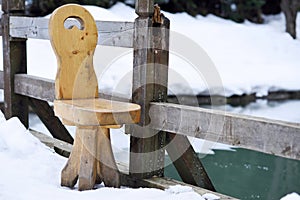 Massive wooden chair standing outdoor