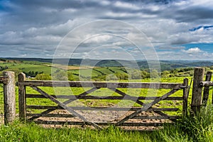 Massive wooden gate in rural countryside