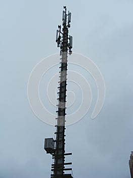 Mast of cellular communication with microwave radio antenna equipment