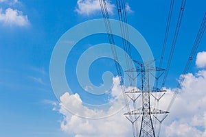 Mast electrical power line against cloud and blue sky background