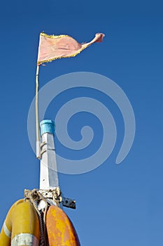 Mast life buoys pink Frayed flag