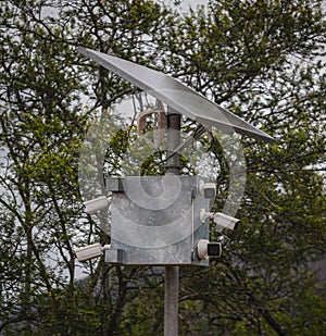 Mast with power source, tracking and transmitting devices in protected natural areas