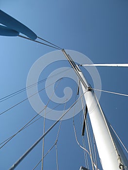 Mast and rigging of sailing boat. Mast going to the sky.