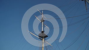 A mast with ropes and wires. Old vintage sail ship