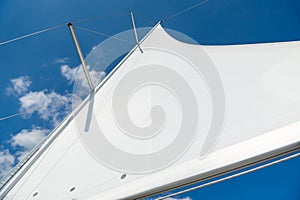 Mast and sail of brand new sailing yacht