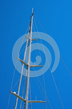 Mast of Sailboat Against a Blue Sky