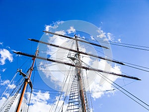 mast of sailing boat with a blue sky