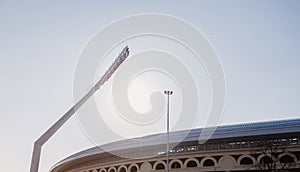 Mast with spotlights on the stadium