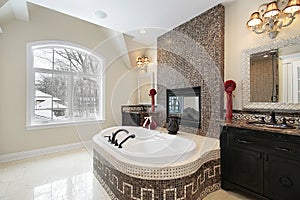 Master bath with marble tile tub