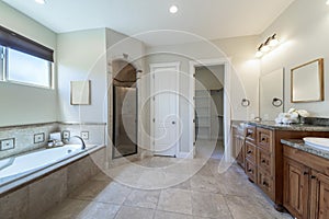 Master bathroom interior with antiqued limestone tiles