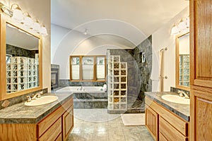 Master bathroom interior with tile flooring and modern cabinets.