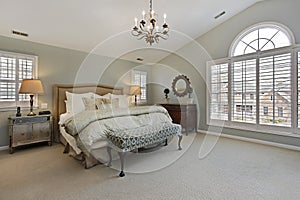 Master bedroom with circular window photo