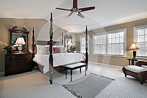 Master bedroom with dark wood furniture