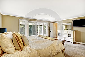 Master bedroom with Double bed and white vanity cabinet.