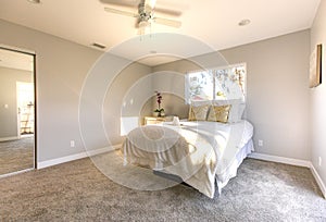 Master bedroom in San Diego model home with white golden light