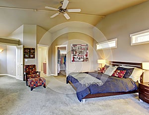 Master bedroom with windows and fireplace.