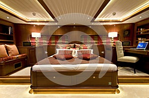 A master cabin in a wooden, classical, luxury yacht.