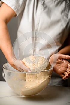 Master chef prepares a sweet dessert for the production of sweets