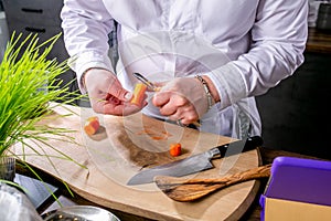 Master class in the kitchen. The process of cooking. Chef cleans vegetables. Step by step. Tutorial. Close-up