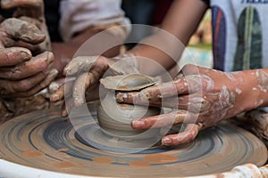 Master class on modeling of clay on a potter& x27;s wheel In the pottery workshop