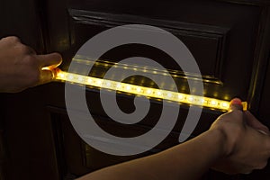 The master installs a decorative led strip in the house for night lighting