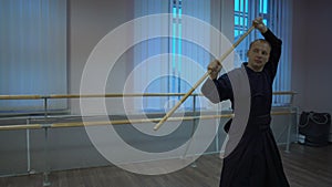 Master kendoka conducts training with denvervyannym sword morning in the sports hall