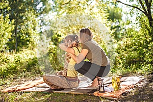 Master massage therapist provides a thorough massage in a forest clearing.