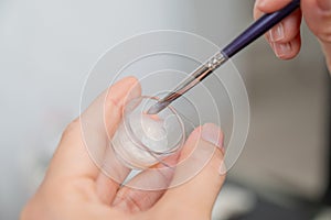 The master mixes eyebrow dye.