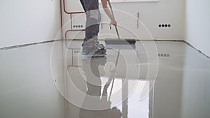 Master with a needle roller. Filling the floor. A contractor painter will paint the garage floor to speed up the sale of your home