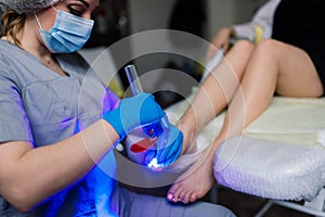 Master during a pedicure. The process of professional pedicures. The concept of beauty and health