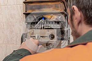 Master performs maintenance of the gas boiler