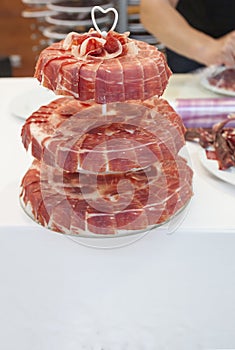 Master slicer decorating with iberian cured ham cake stand with