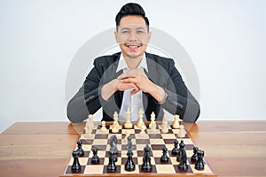 A master smile with chess pieces on a chessboard