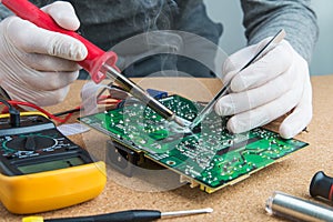 Master solders the electronic board