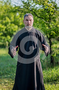 Master of taijiquan practicing qigong in the park