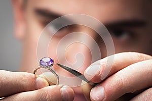 Master will examine the jewelry for defects photo