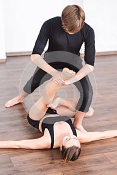 Masterful good looking woman exercising on the floor