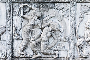 masterpiece of traditional Thai style stucco art old about Ramayana story on temple decorative wall at Wat Panan Choeng temple, A