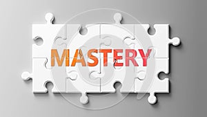 Mastery complex like a puzzle - pictured as word Mastery on a puzzle pieces to show that Mastery can be difficult and needs photo