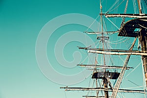 Masting of the big wooden sailing ship. Background